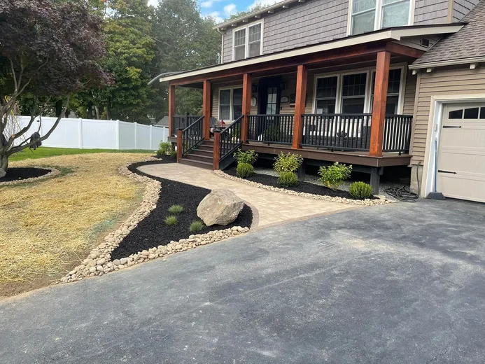 Garden bed with shrubs and flowers installed by Lawn Spa Landscaping