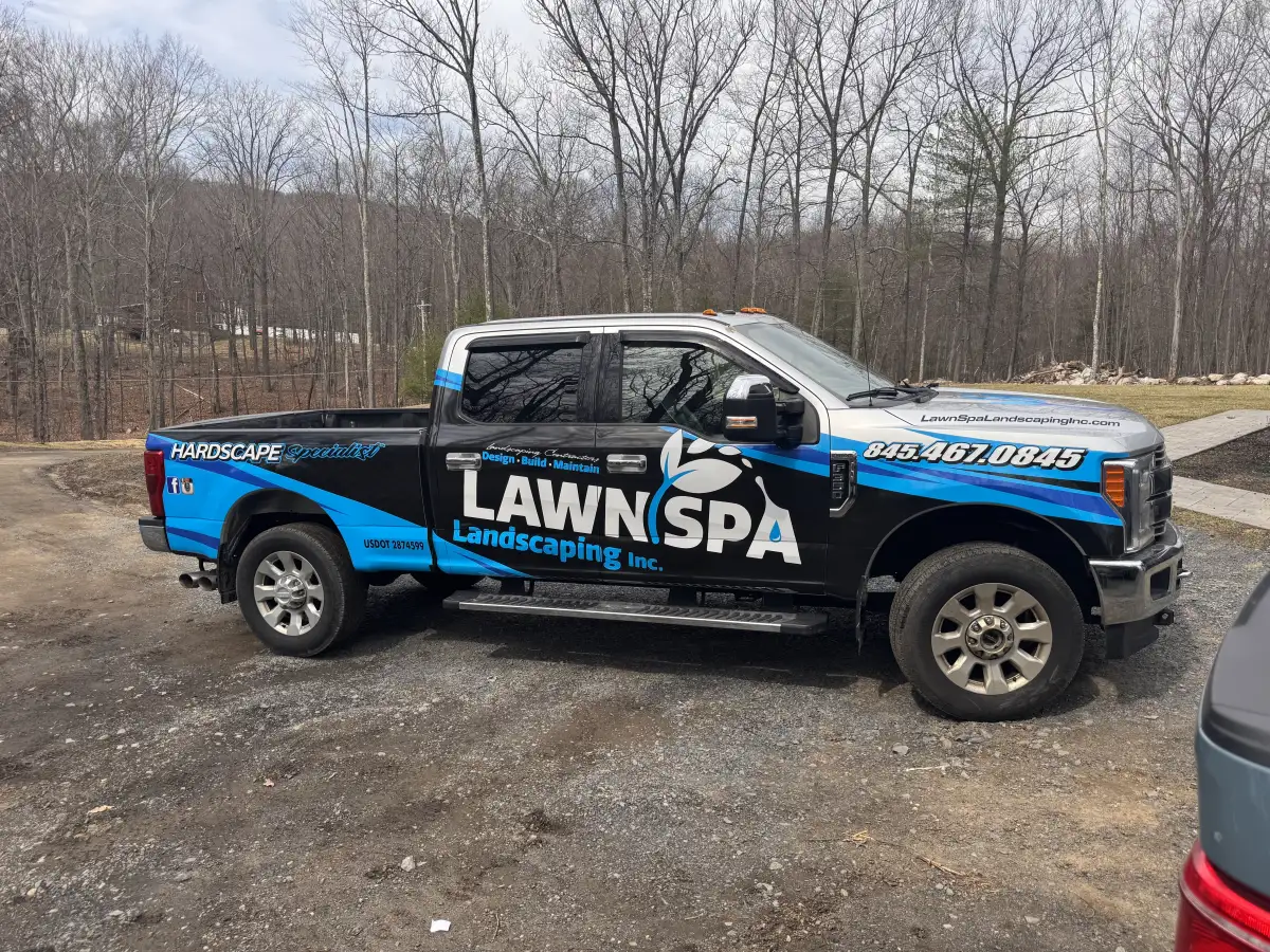 Lawn Spa Landscaping equipment staged for hydroseeding and lawn restoration